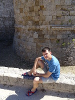 2019.05.31 Sitting at the foot of a tower of the Rhodes Fortress.