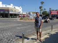 2021.07.27 On the Ayia Napa's circle with the “2 Fish” (Δύο ψάρια) fountain where the streets of Archbishop Macarius (Αρχιεπισκόπου Μακαρίου) III, of Saint George (Αγίου Γεωργίου) and of the 1st October (1 Οκτωβρίου) converge.