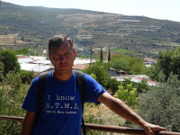 2021.08.01 Against the background of the view from the typical Cypriot village of Omodos (Ομοδος) to the surrounding it mountains of Troodos (Τρόοδος).
