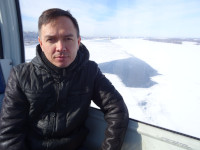 2022.03.17 A view from a cabin of the “Nizhny Novgorod – Bor” cable car to me (serious, closer up) and the same melted “heart” of the Volga.