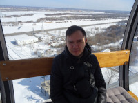 2022-03-17. The bright sun on the ferris wheel with the Georgian name “NiNo” (in fact, this is someone's stupid abbreviation of “Nizhny Novgorod”) makes me look narrow-eyed 😎, a view to the remains of the city when descending to the Volga.