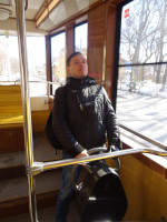 2022-03-17. Inside a tram (this time a real one) of Nizhny Novgorod (Russia), at a strange steering wheel 🤔, puffing up with pride, in a vertical frame.