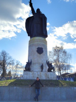 2022-04-15. The monument to Ilya Muromets (naturally, in Murom, Vladimir region, Russia) is difficult to fit together with the sword even in a vertical frame, and in addition the photograph was against the sun, I was almost invisible, and only Fotor.com could fix it.