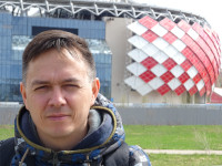 2022-04-30. A close-up portrait against the background of the home stadium of the red-and-white “Spartak” under the name of (its general sponsor) “LUKoil Arena” ex. “Otkrytie Arena”.