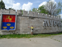 2022-06-10. I am torn between the coat-of-arms of Murom (of Vladimir region, Russia – this can be seen from the upper part of the coat-of-arms) and its name on the wall imitating a fortress one.