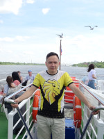 2022-06-10. Usually there are (almost) no other people in my personal photographs, but here I had to leave them – as the view from the Murom ship on the Oka is too good, especially with gulls, especially with the one that is exactly above the flagpole.