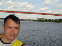 2022-06-10. Sailing on a pleasure boat to the Murom Bridge, a close-up and closer to the bridge.