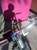 2022-06-24. The shadow of me, who reached 100+ km of the cycling season late, on the wall of the pink 😁 “VladBusinessBank”.