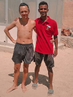 2022-08-26. A lifeguard on a Hurghada beach named Mahmoud and I 🤗, photographed by his smartphone.