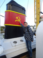 2022-10-09. I am kind of holding on to the painted symbol of the great country that created this medium-sized fishing trawler SRT-129, moored on the Pregola river by the Museum of the World Ocean in Kaliningrad (Königsberg), Russia.