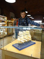 2022-10-10. At the Kaliningrad Marzipan Museum: next to a sailboat made of marzipan (thick paste of grated almonds with powdered sugar or syrup), encased in a glass cube.