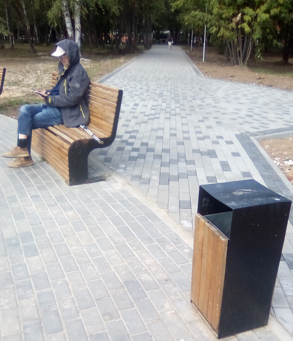 Bench and a Trash Can in the Middle of a Footpath (Vladimir, Russia)