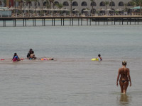 Contrast of Civilizations While Bathing