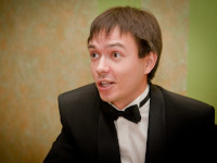 2011.12.26 Talking something to somebody at the company's celebration of the New Year 2012. 
© 2011 Sergey Lakeev