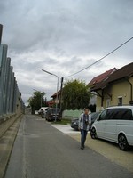 /201.60.91 Walking in an Austrian street, in a residential area of Vienna.