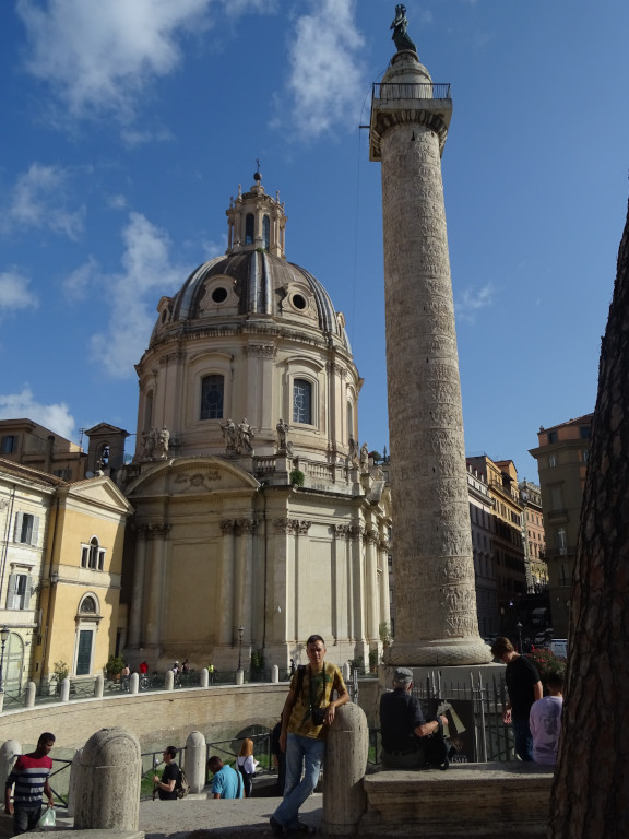 2019.10.03 Against the background of the Church of the Holy Name of Mary (at the left) and Trajan's Column (at the right).