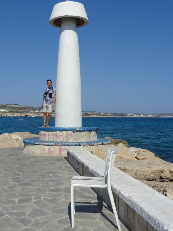 2021.07.27 I am propping up one of the lighthouses at the entrance to the Ayia Napa Harbor.
