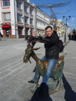 2022.03.16 Stradded the “Merry Goat” sculpture on the Theater Square of Nizhny Novgorod (Russia), a side view to Bolshaya Pokrovskaya Street.