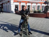 2022.03.16 Stradded the “Merry Goat” sculpture on the Theater Square of Nizhny Novgorod (Russia), the front view to the “Сhoсoladnitsa” cafe.