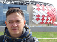 2022.04.30 A close-up portrait against the background of the home stadium of the red-and-white “Spartak” under the name of (its general sponsor) “LUKoil Arena” ex. “Otkrytie Arena”.