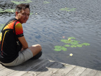 2022.07.15 On the bridges of the Moon Lake, equipped with by “Pearl” Park Hotel; sitting, half-turned.