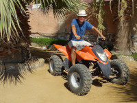 2022.08.20 On an ATV I have never ridden, of a color I do not like but which is often seen in my life.