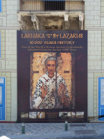 Плакат, посвящённый святому Лазарю (St. Lazarus) в городе, тесно с ним связанном (Larnaka – City of…), и 10 000 лет истории (10.000 years [of] history).